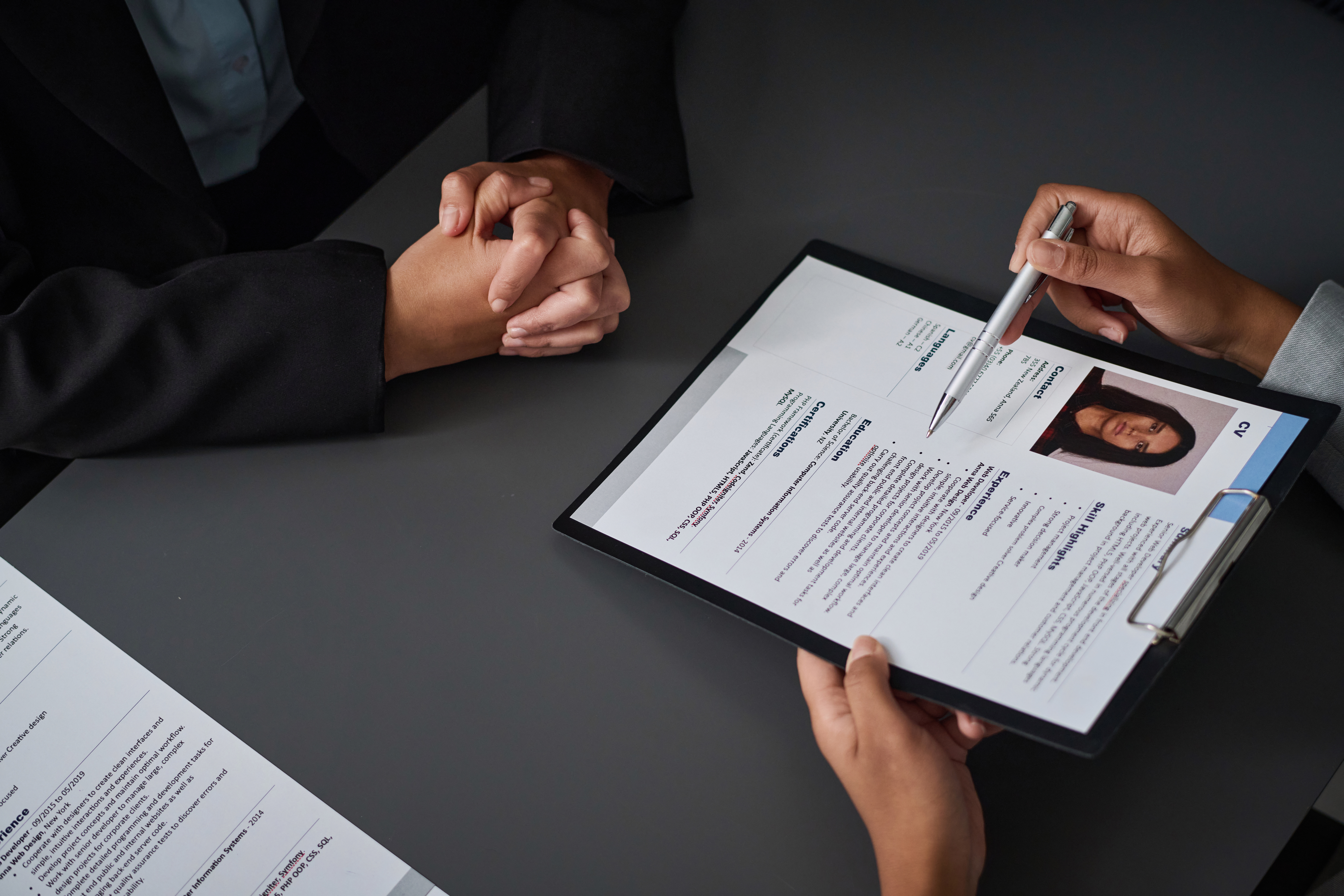An HR manager looking at a sales resume